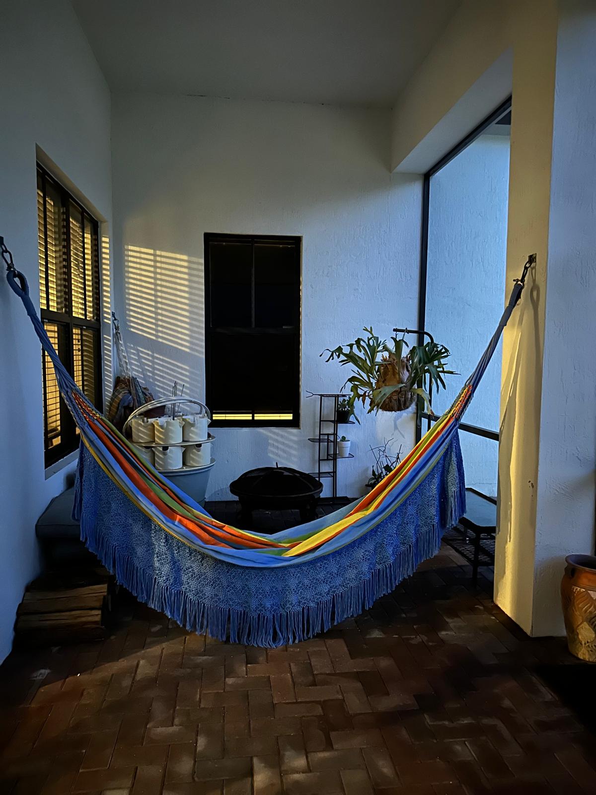 Covered lanai hammock and fire pit nook